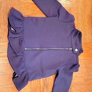 A gray sparkley jacket